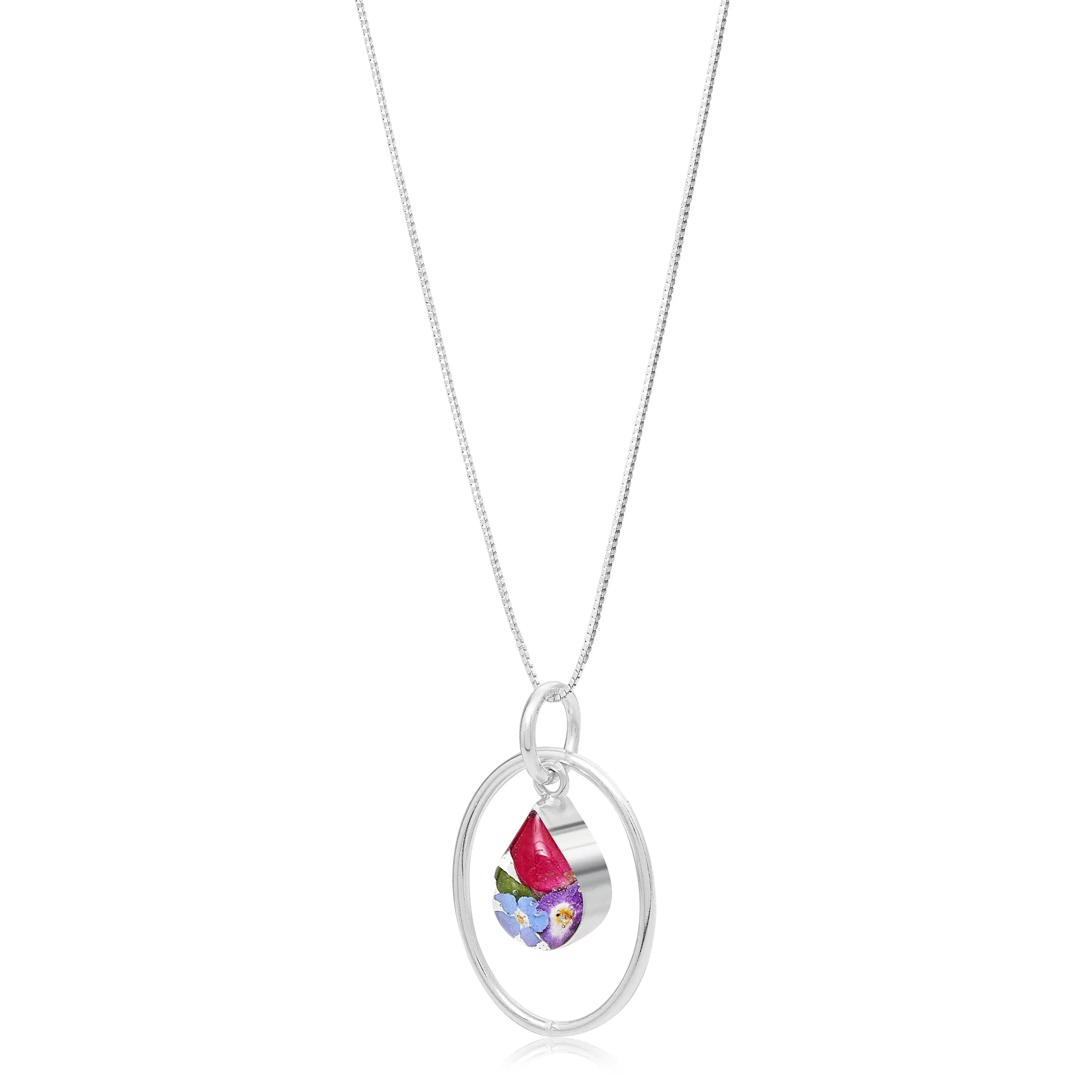 Real flower necklace by Shrieking Violet® Sterling silver oval pendant with real flowers & silver oval surround. Stylish gift for nature lovers.