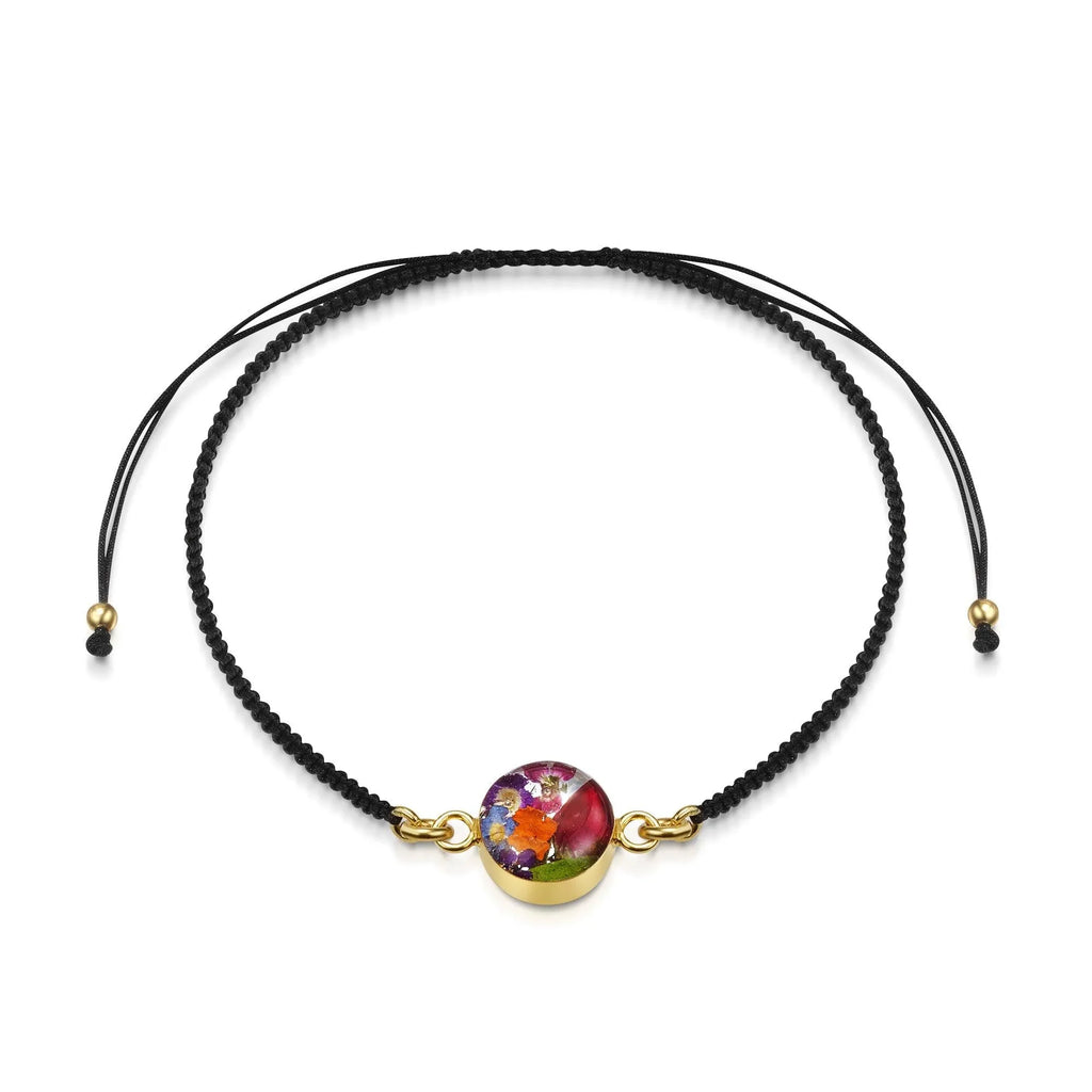 Flower bracelet | Black woven bracelet with gold-plated flower charm by Shrieking Violet®