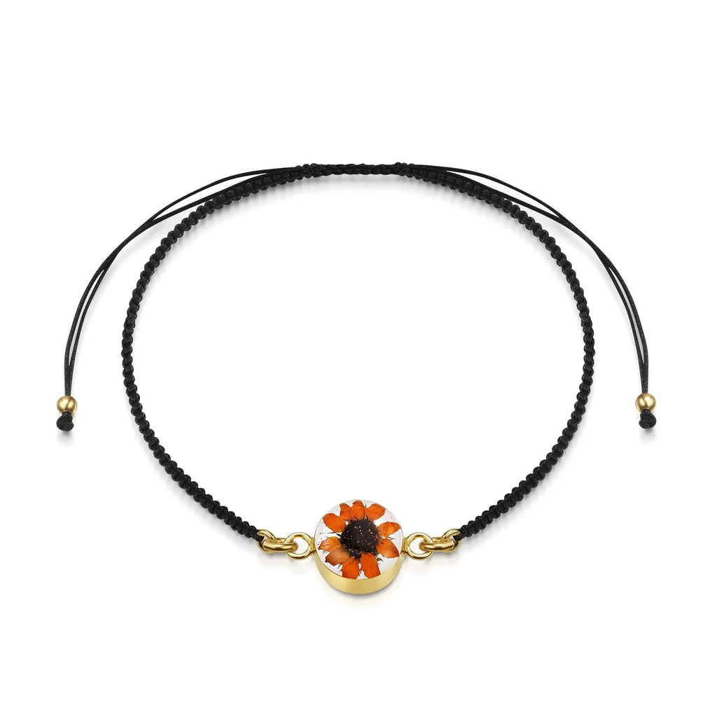 Flower bracelet | Black woven bracelet with gold-plated flower charm by Shrieking Violet®