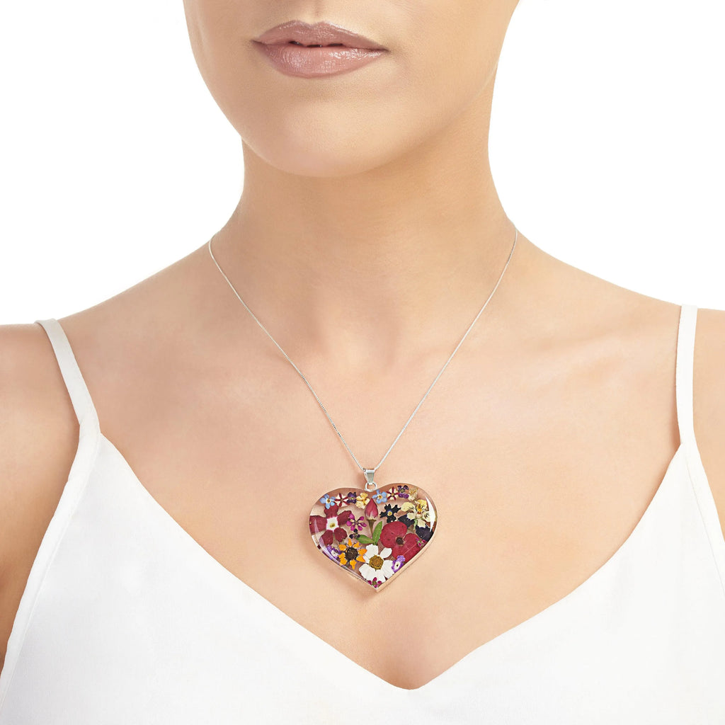 Shrieking Violet heart necklace with real flowers including rose, daisy, poppy, forget-me-not & sunflower. Statement jewellery for nature lovers