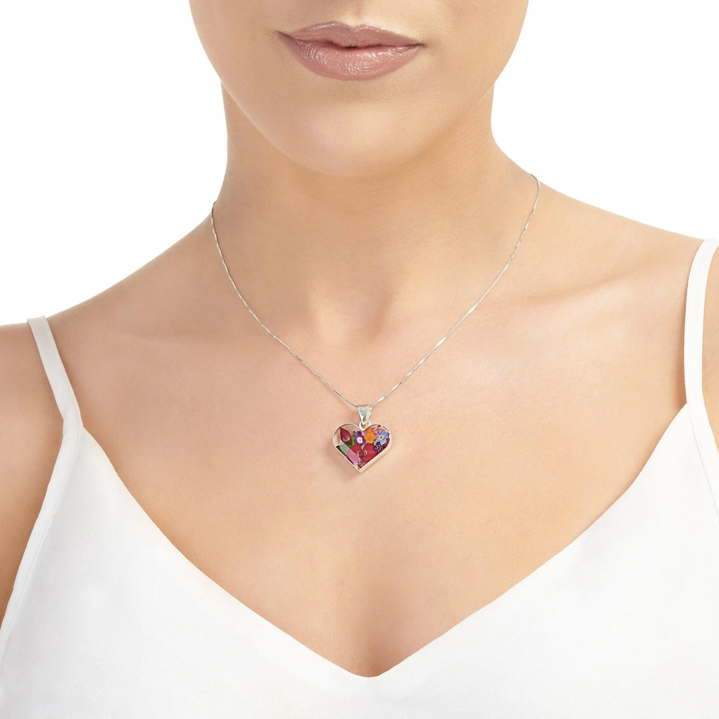 Sterling silver heart-shaped pendant necklace with real flowers. Perfect Mothers day gift.